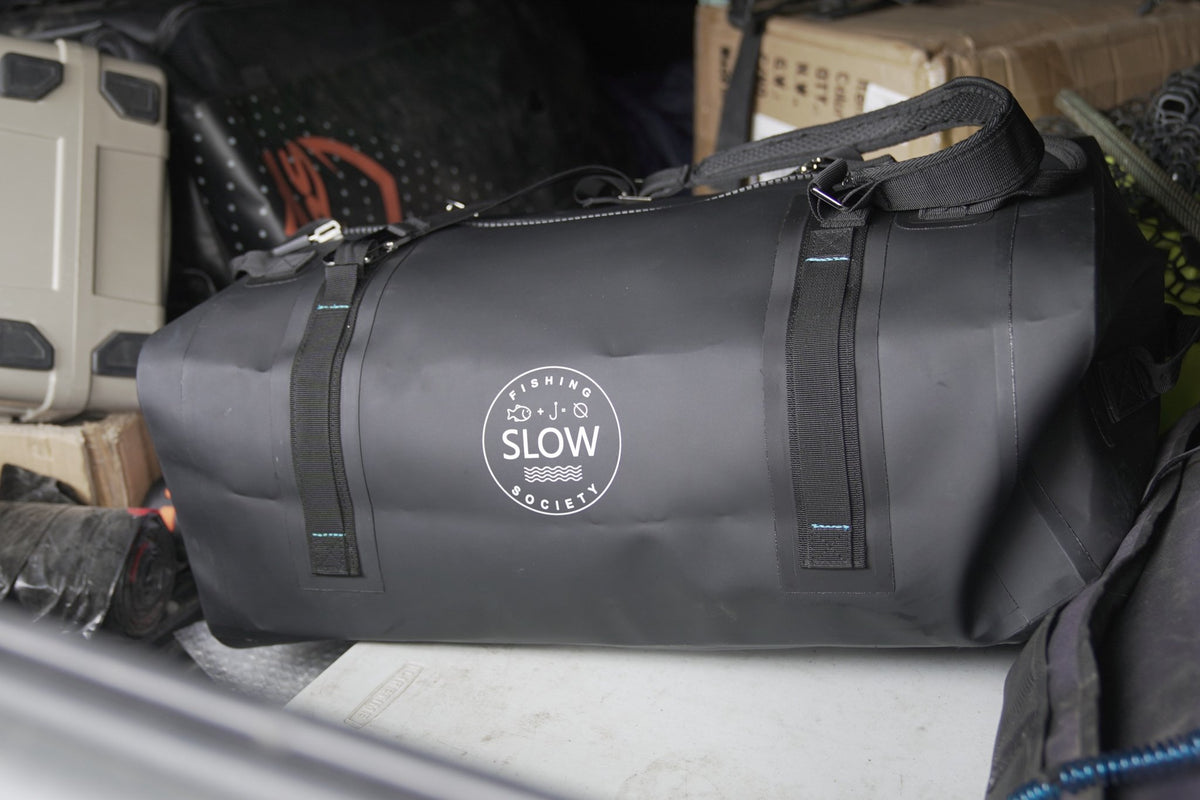 Black duffle in the back of a truck
