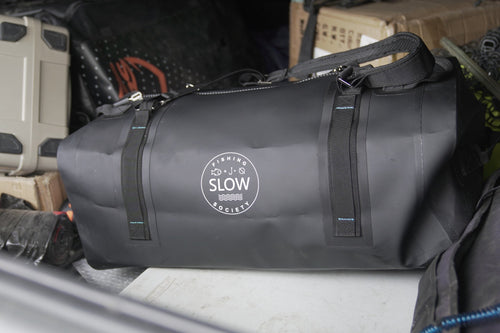 Black duffle in the back of a truck